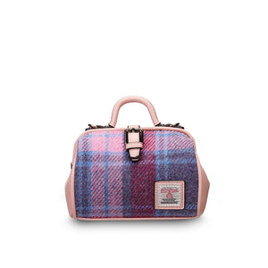 A charming mini doctor bag crafted from a playful pink and blue tartan Harris Tweed, featuring two top handles for versatile carrying. Presented on a clean white background. (Islander)