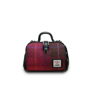 A classic mini doctor bag crafted from a bold red tartan Harris Tweed, featuring two top handles for versatile carrying. Presented on a clean white background. (Islander)