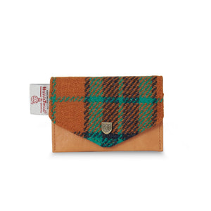 Front view of Harris Tweed orange and blue tartan card wallet with microfibre leather and metal crest detail.