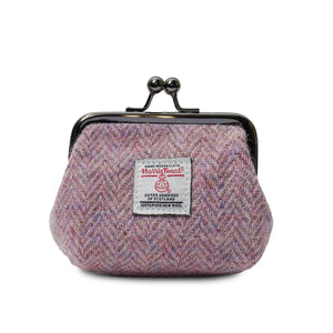 Ladies Harris Tweed Coin purse in a pink herringbone fabric and with a metal clasp closer.