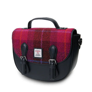 A red tartan Harris Tweed Cobble Satchel, angled to showcase its spacious interior and distinctive design.