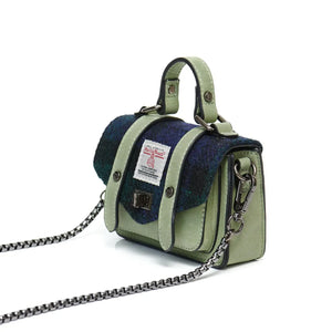 Side view of the Islander Harris Tweed Wee Satchel with the chain shoulder strap off to the side. 