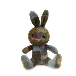 A chestnut brown and blue Islander tartan lambswool bunny sitting upright with its ears perked up.