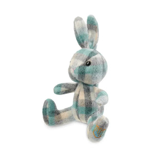 A cream and blue Islander tartan lambswool bunny viewed from the side, showcasing its soft fur and floppy ears.




