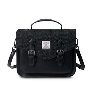 A sleek black herringbone satchel bag, showcasing its elegant design and practical features.