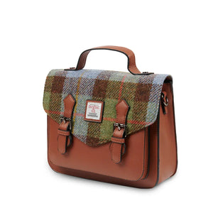 A side view of a stylish chestnut and blue tartan Harris Tweed satchel bag, highlighting its spacious interior and practical design.