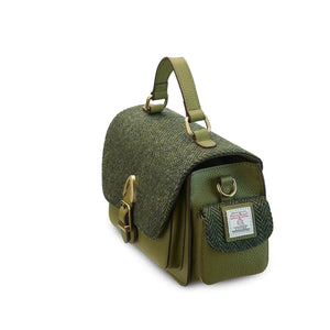 A side view of a green Harris Tweed Melrose Leather Crossbody Bag. It has a spacious interior and a sturdy top handle.