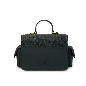 A back view of a black herringbone Harris Tweed Melrose Leather Crossbody Bag. It shows the back of the bag and the Harris Tweed fabric detail.