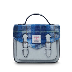 A front view of a blue tartan Mini Calton Satchel, highlighting its Harris Tweed® panel and metal chain strap.