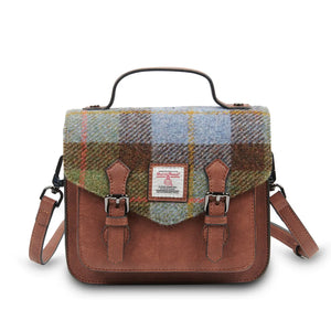 A front view of a stylish chestnut and blue tartan Harris Tweed Mini Calton Satchel, showcasing its authentic Harris Tweed® panel and metal chain strap.