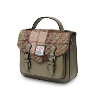 A side view of a stylish chestnut tartan Harris Tweed Mini Calton Satchel, showcasing its compact size and adjustable strap.