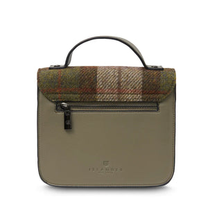 A rear view of a chestnut tartan Harris Tweed Mini Calton Satchel, displaying its additional pocket and metal chain strap.