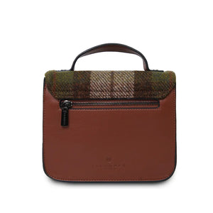 A rear view of a chestnut and blue tartan Harris Tweed Mini Calton Satchel, displaying its additional pocket and metal chain strap.