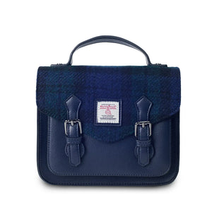 A front view of a black watch tartan Harris Tweed Mini Calton Satchel, highlighting its authentic Harris Tweed® panel and metal chain strap.