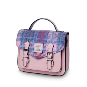 A side view of a vibrant pink and blue tartan Harris Tweed Mini Calton Satchel, showcasing its compact size and adjustable strap.