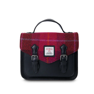 A front view of a red tartan Harris Tweed Mini Calton Satchel, highlighting its authentic Harris Tweed® panel and metal chain strap.