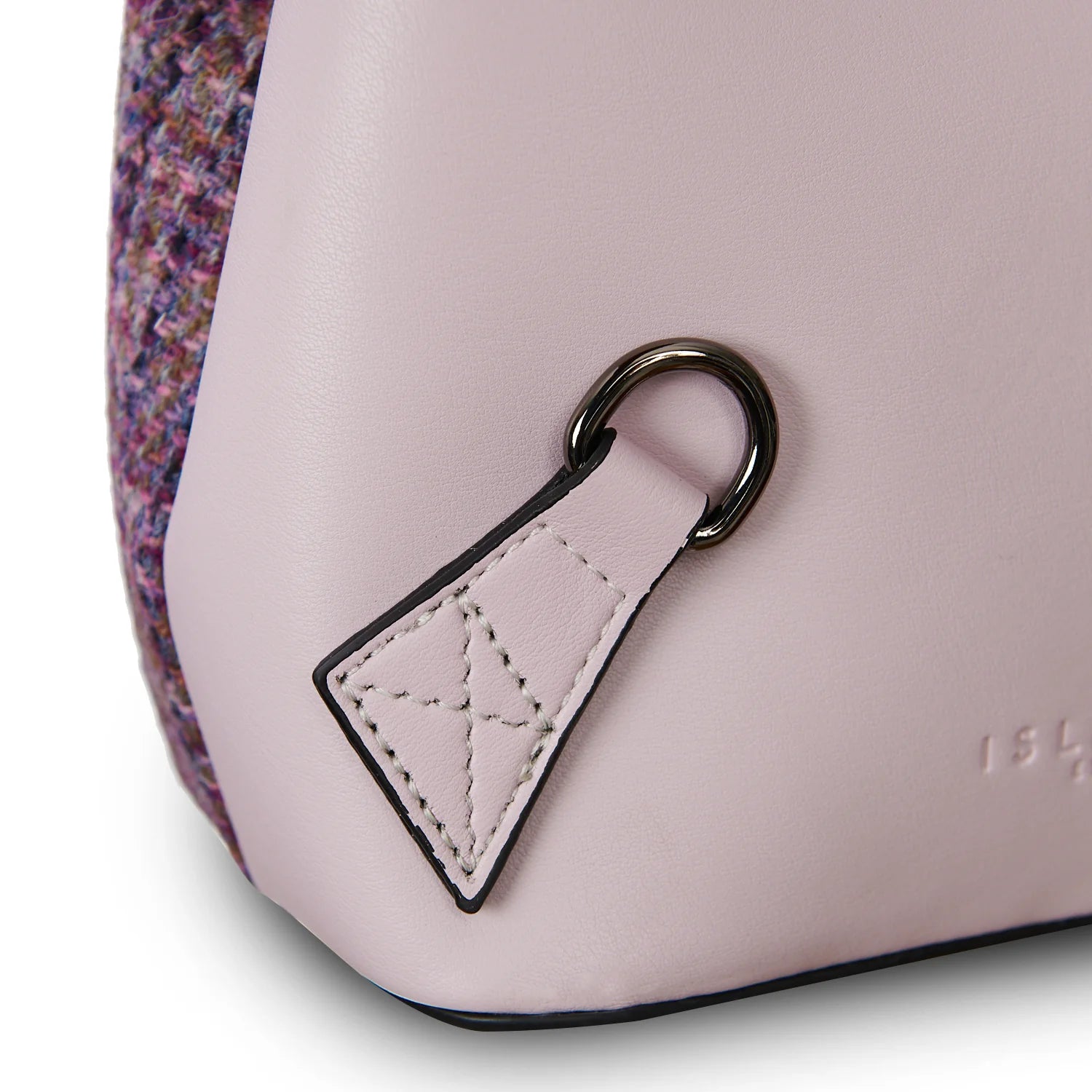 Side D-ring attachment and leather patch detail on violet mini backpack