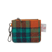 Front view of orange and blue Harris Tweed® tartan card zip wallet with key clip and branded label.