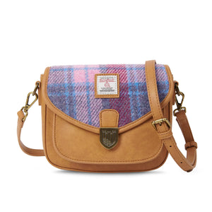 Ladies Mini Saddle Bag with Pink & Blue Tartan Harris Tweed. The shoulder strap is draped across the top.