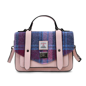 Picture of a Harris Tweed Satchel finished with a pink PU leather body and a blue and pink tartan pattern fabric.