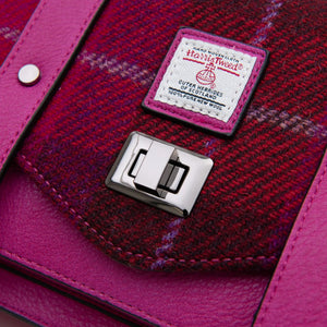 Close up of the clasp closure of the Harris Tweed satchel.
