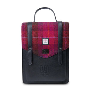 A red tartan Islander Carloway backpack against a white background.