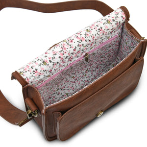 Inside the saddle bag showing the floral lining and the internal zipped pocket.