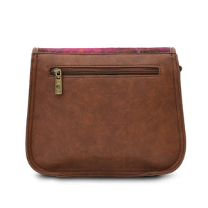 From behind showing the dark brown PU leather and the zipped pocket.