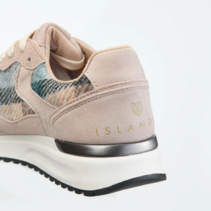 Rear view of Islander Rosie trainer with gold Islander branding on the heel.