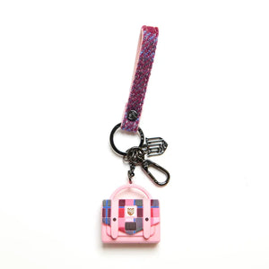 A stylish pink and blue tartan Harris Tweed keyring by Islander Satchel, displayed on a white background.