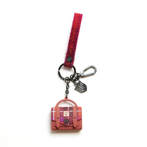 A vibrant red tartan Harris Tweed keyring by Islander Satchel, displayed on a white background."