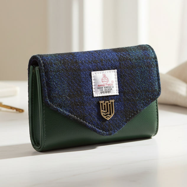 Black Watch tartan Harris Tweed clasp purse angled view on white background.