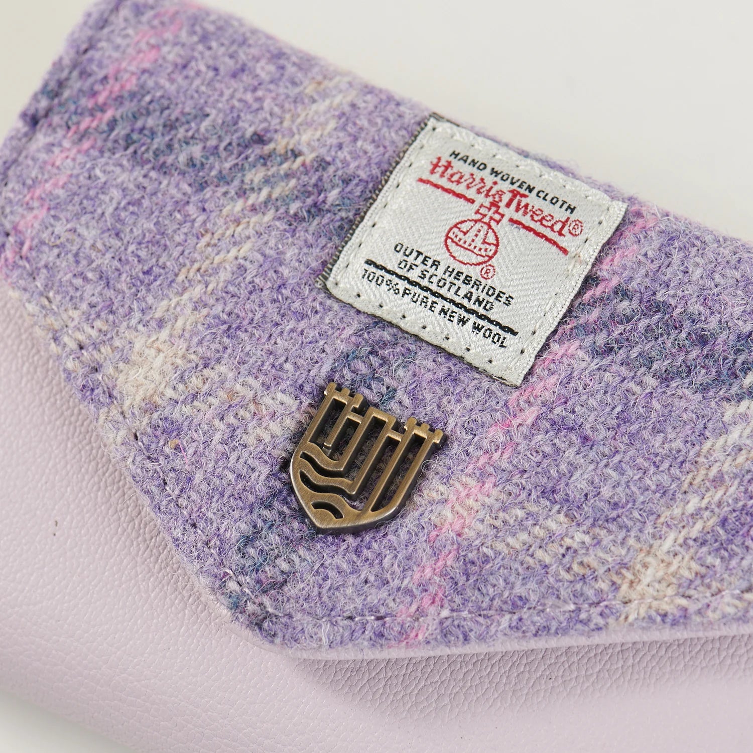 Purple tartan Harris Tweed purse back showing zip pocket in pink leather.