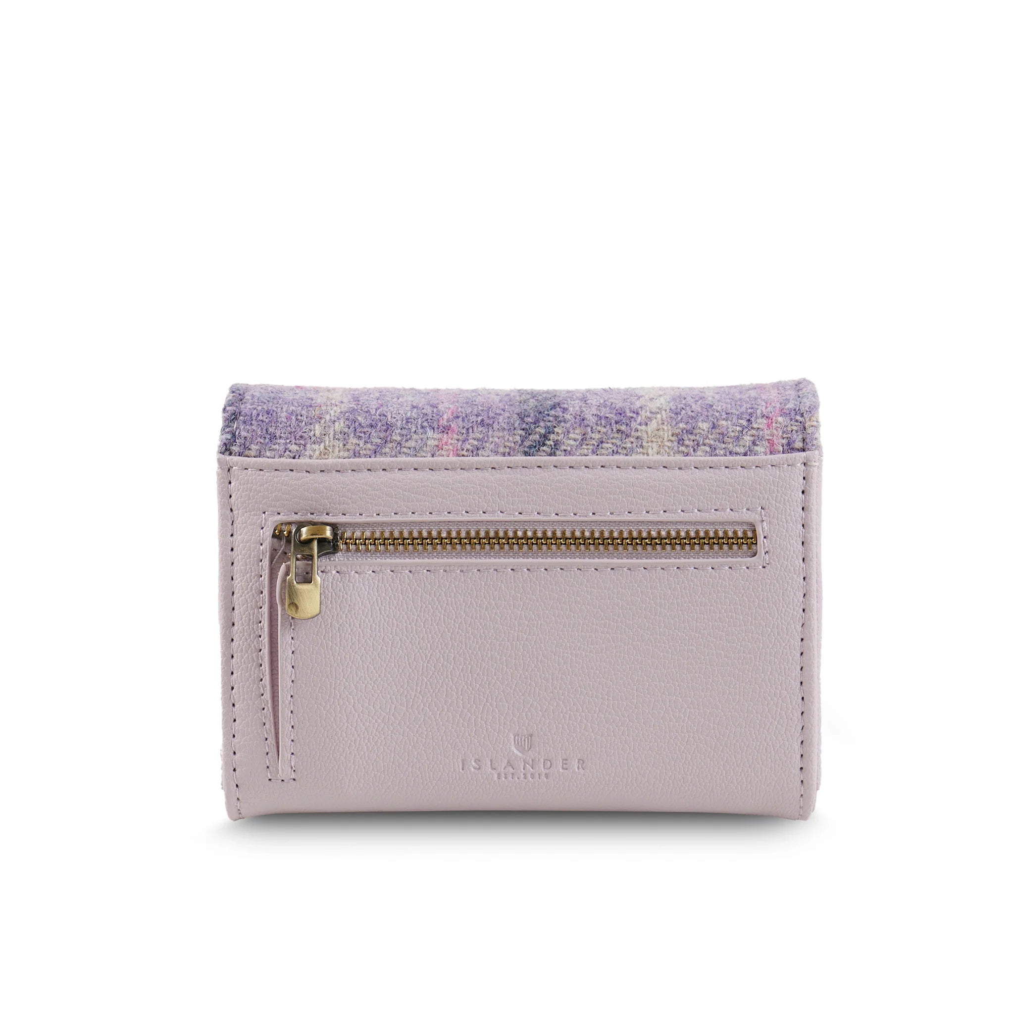 Close-up of purple tartan weave and gold badge detail.