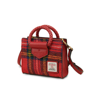 Angled side view of the Mini Arran Tote showcasing vibrant red Stewart Tartan Harris Tweed®, gold-tone hardware, braided handle, and detachable crossbody strap.
