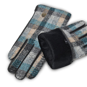 Interior view of gloves with soft black faux fur lining and small size tag, paired with visible Harris Tweed® exterior.
