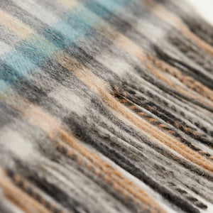 Fringed edge of Islander tartan lambswool scarf showing detailed weave.