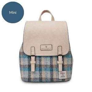 Harris Tweed backpack in mini size. It has a cream coloured PU leather body and a blue and cream tartan pattern.