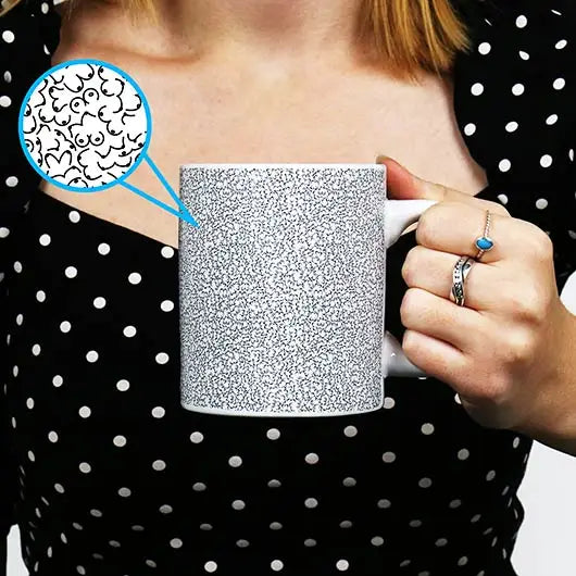 Person holding Itty-Bitty-Titty Mug with hidden boob pattern design