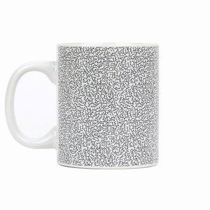 Close-up of Itty-Bitty-Titty Mug showing microscopic boob pattern