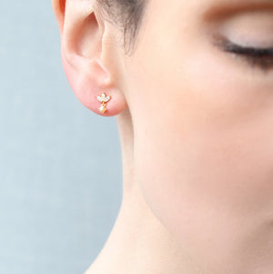 Japanese Petal Stud Earrings worn by a model, showcasing their elegant and dainty fit.