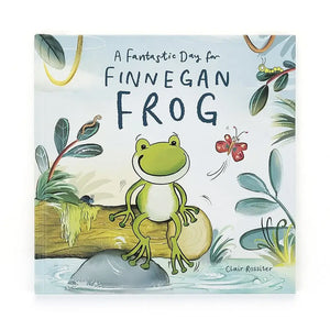 A colorful children's book cover titled "A Fantastic Day for Finnegan Frog." Finnegan, a bright green frog, leaps through the air with a smile on his face. The background shows a pond scene with lily pads and other pond creatures.