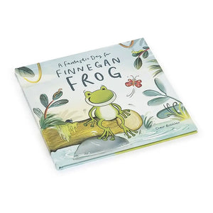 Two pages of "A Fantastic Day for Finnegan Frog" open, showcasing colorful illustrations and rhyming text. Finnegan and his friends are swimming and playing in the pond. Spot-gloss accents shimmer on some elements.