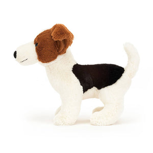 From the side Jellycat Alexander Jack Russell children's soft toy with his tail sticking up behind.
