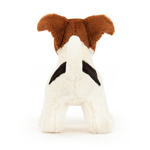 From behind the Jellycat Alexander Jack Russell children's soft toy stands on all four legs.