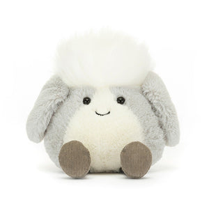 Quirky Jellycat Amuseabean Sheepdog with silver-grey fur, floppy ears, a playful smile, and cordy boots, perfect for adding character to desks or bringing good luck.