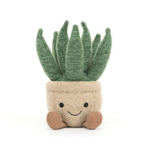 Adorable Jellycat Amuseable Aloe Vera Small plush with a friendly expression, featuring punky green "succulent" arms, toffee cord boots, and a beanie base, potted in a felt biscuit container.