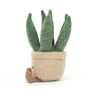 Punny and charming Jellycat Amuseable Aloe Vera Small plush in profile, highlighting its fluffy "succulent" arms, cute beanie base, and toffee cord boots, resting in a round felt biscuit pot.