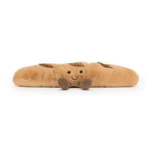 The Jellycat Amuseable Baguette facing front with his little brown legs sticking out in front. 