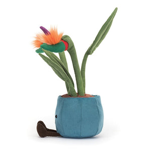 A side view of the Jellycat Amuseable Bird of Paradise plush, showcasing its sturdy green stalks with fluted leaves reaching towards the sky. The plush bird of paradise flower sits proudly at the top, adding a touch of tropical flair.